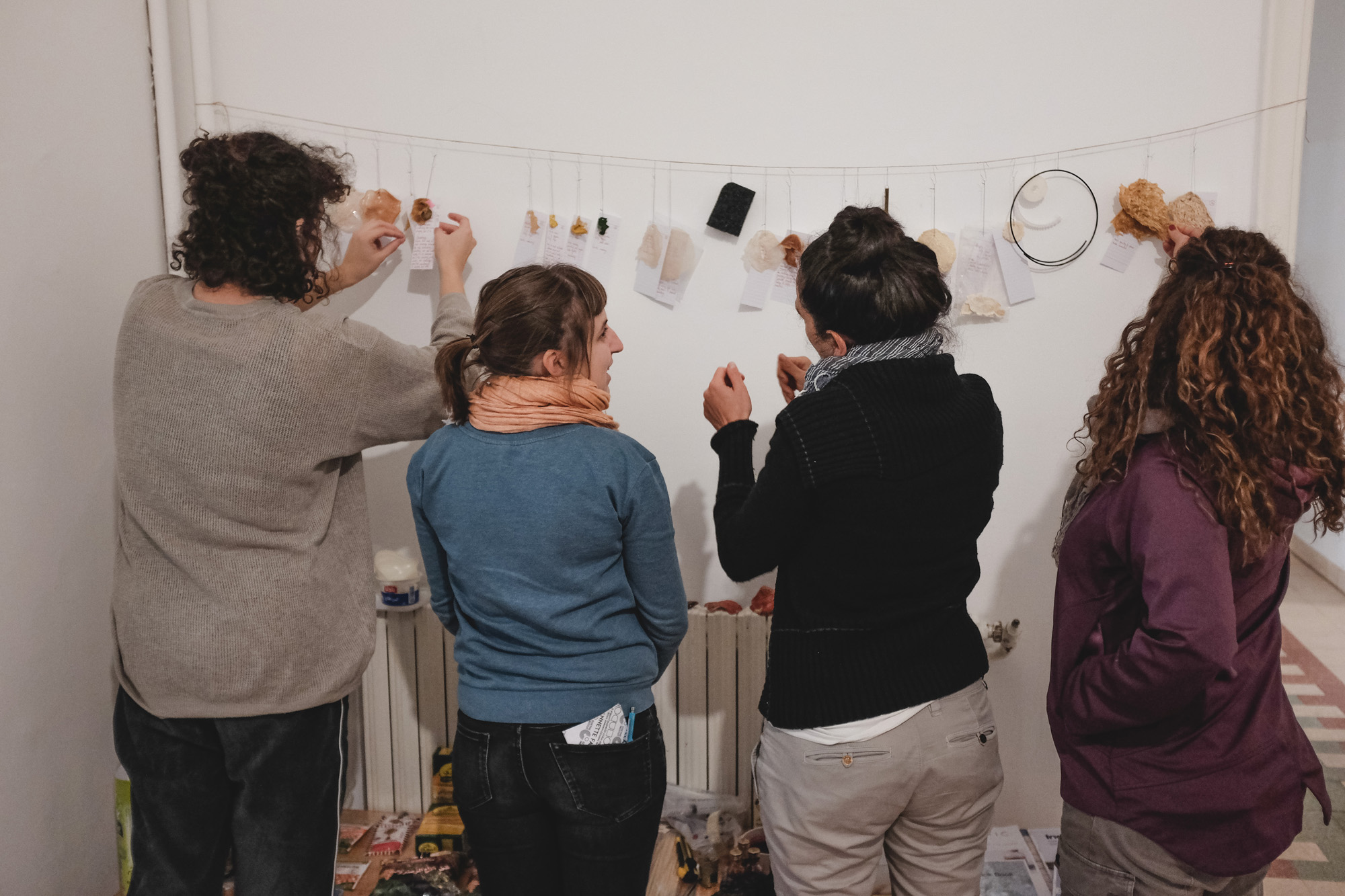 Participants studying samples of Kombucha leather